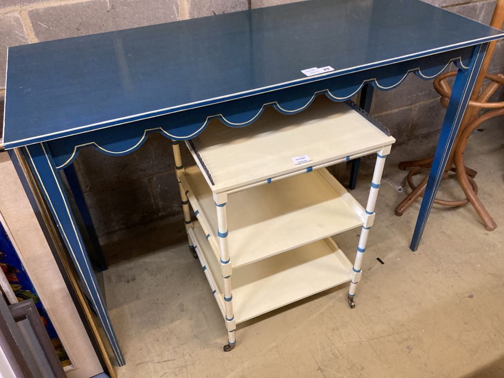 A Regency style cream painted three tier bedside table, a blue painted white lined dressing table (2) larger width 121cm, depth 51cm, h